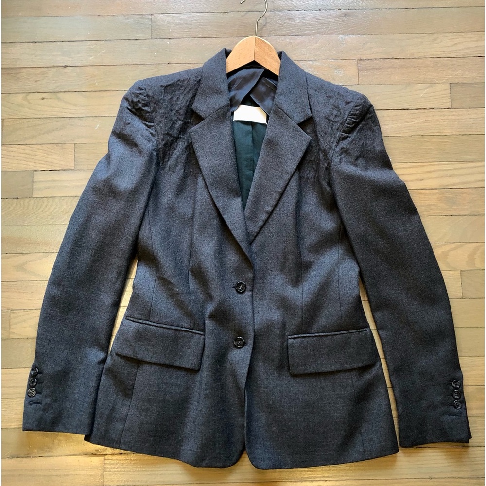Wool blazer, perfect condition. Has accentuated boiled wool shoulders